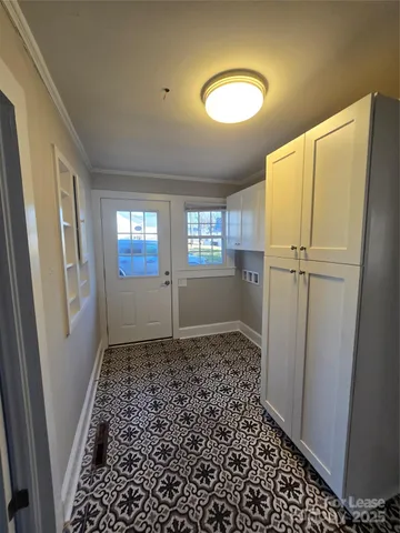 a view of a hallway to rooms