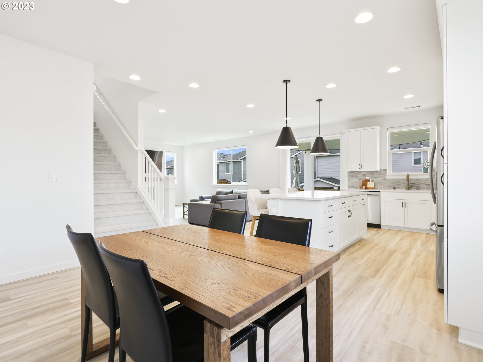 3005 North Mccanta Way Ridgefield, WA 98642 - Photo 12 of 37 a large kitchen with a table and chairs