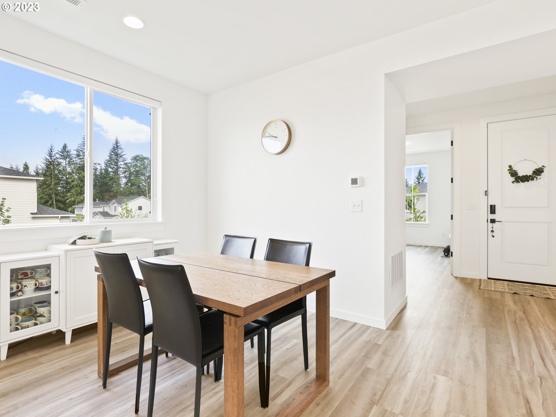 3005 North Mccanta Way Ridgefield, WA 98642 - Photo 13 of 37 a view of a dining room with furniture and wooden floor