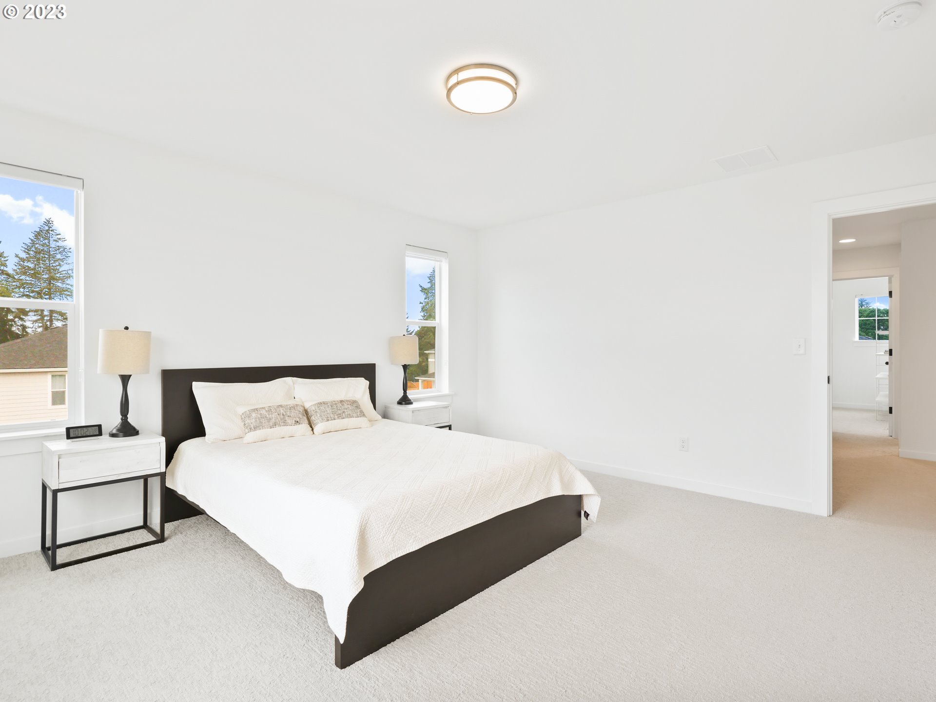 3005 North Mccanta Way Ridgefield, WA 98642 - Photo 18 of 37 a large bedroom with a bed and a large window