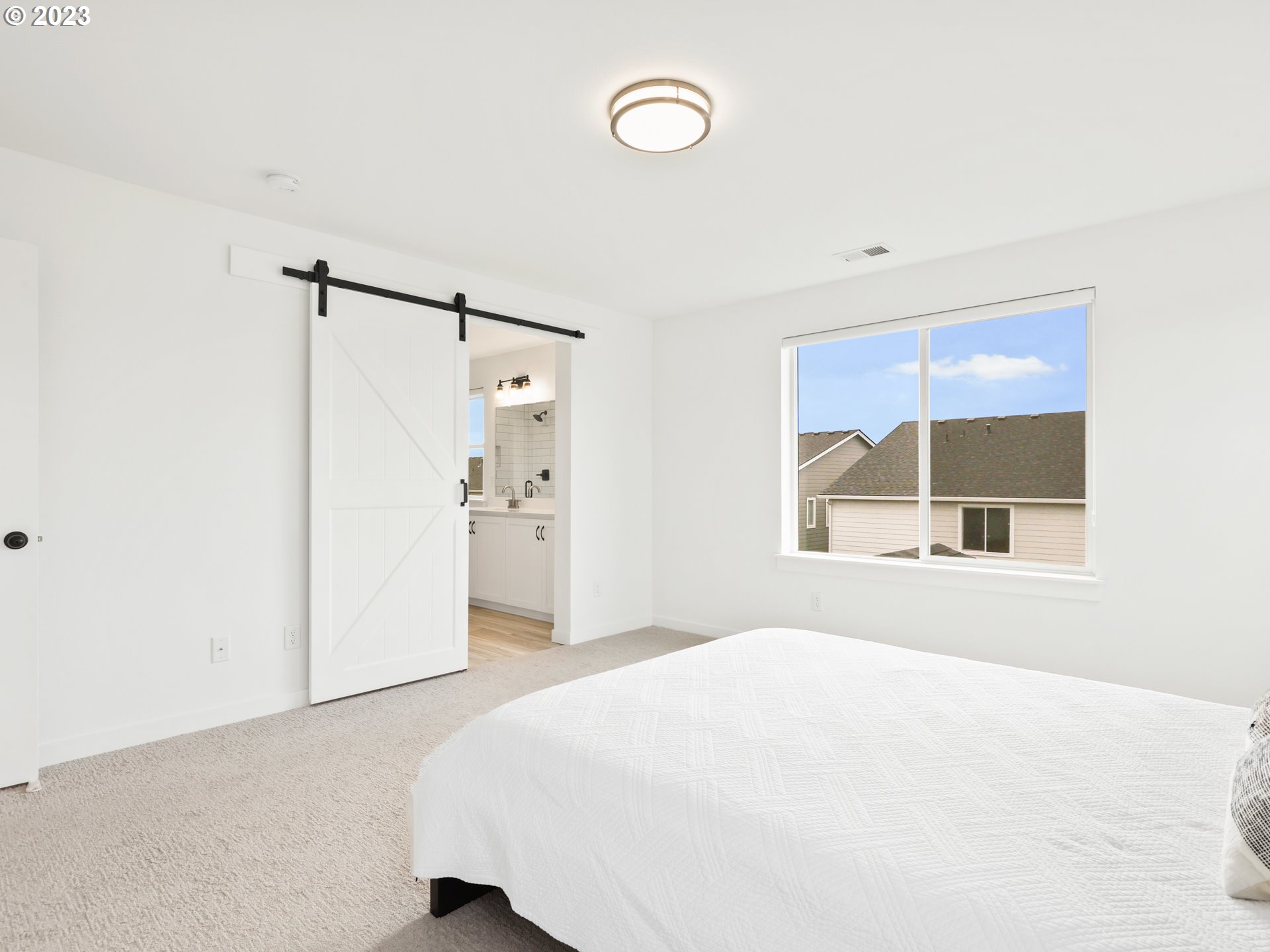 3005 North Mccanta Way Ridgefield, WA 98642 - Photo 19 of 37 a bedroom with a bed and a window