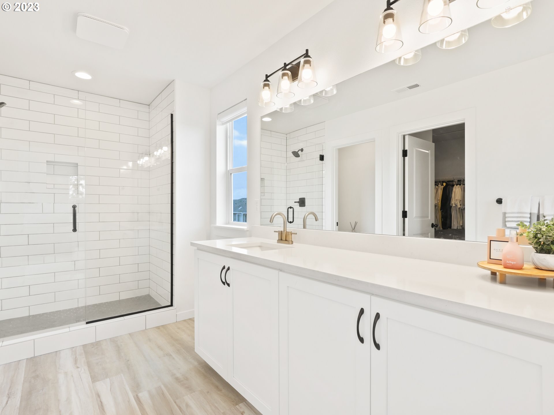 3005 North Mccanta Way Ridgefield, WA 98642 - Photo 20 of 37 a bathroom with a double vanity sink a mirror and shower