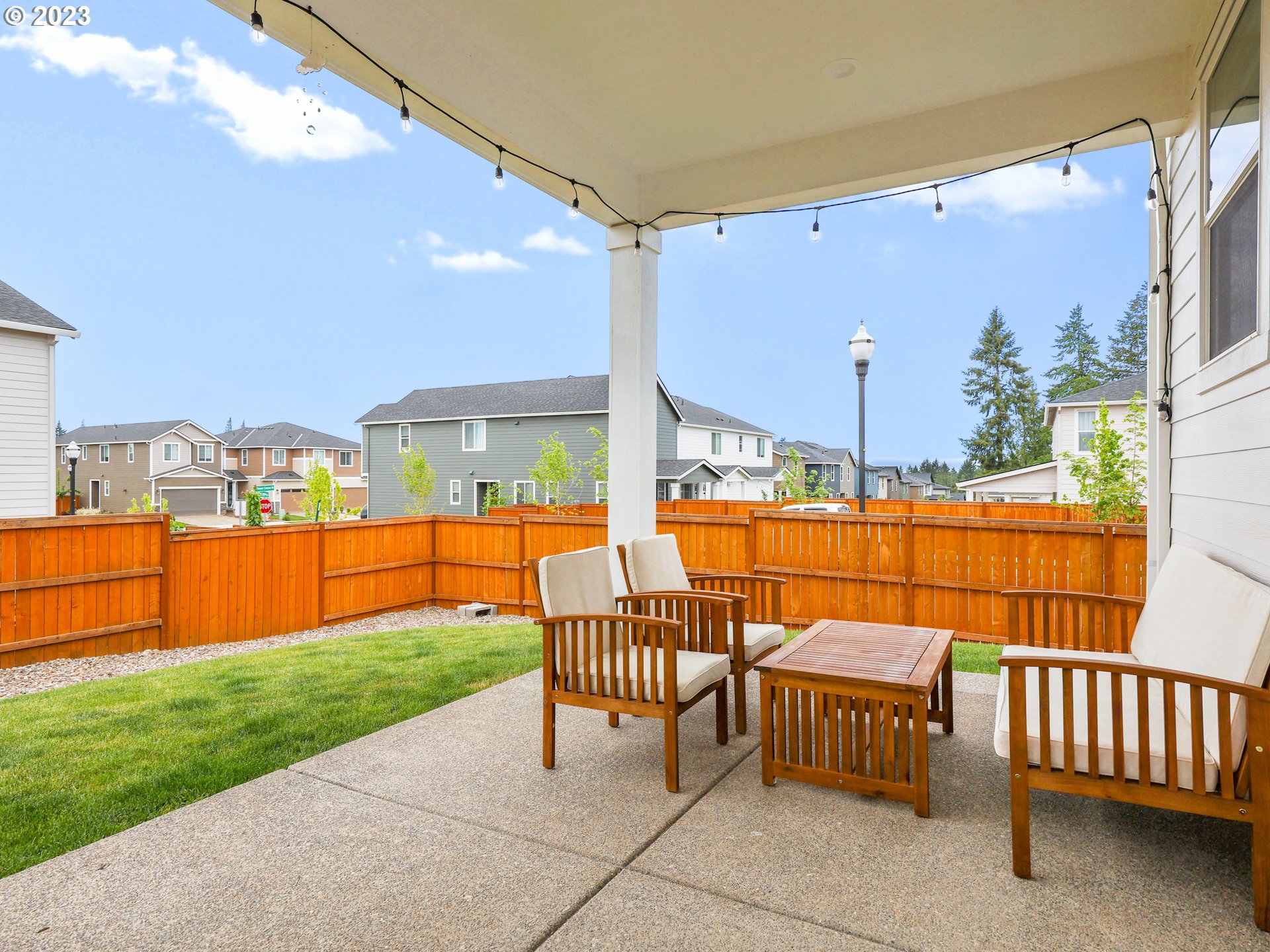 3005 North Mccanta Way Ridgefield, WA 98642 - Photo 32 of 37 a backyard view with a seating space and furniture