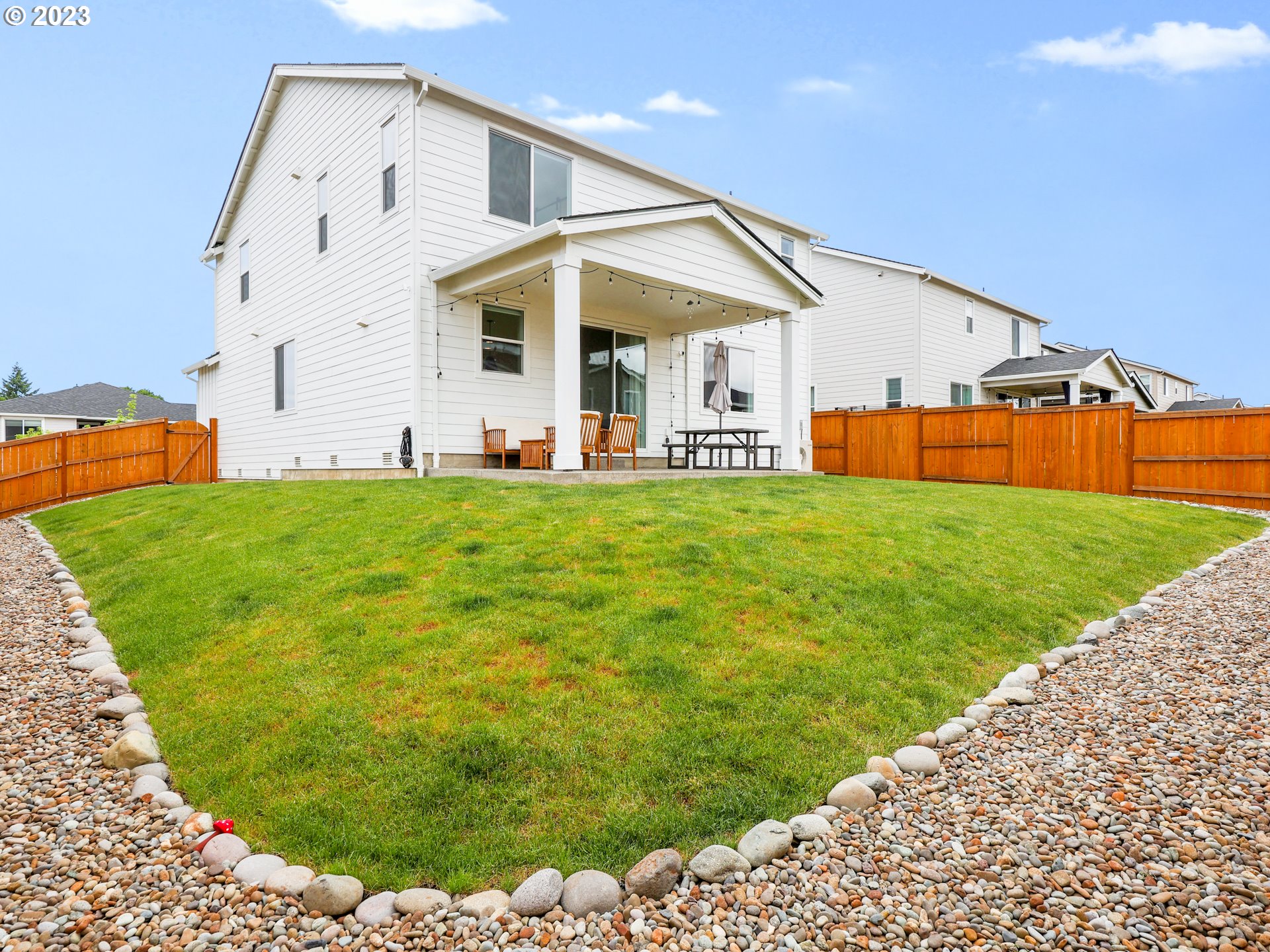 3005 North Mccanta Way Ridgefield, WA 98642 - Photo 35 of 37 a view of a house with a yard and sitting area