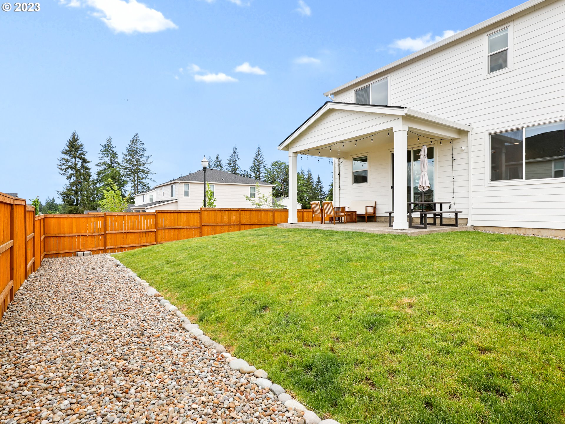 3005 North Mccanta Way Ridgefield, WA 98642 - Photo 37 of 37 a view of a house with a yard and sitting area