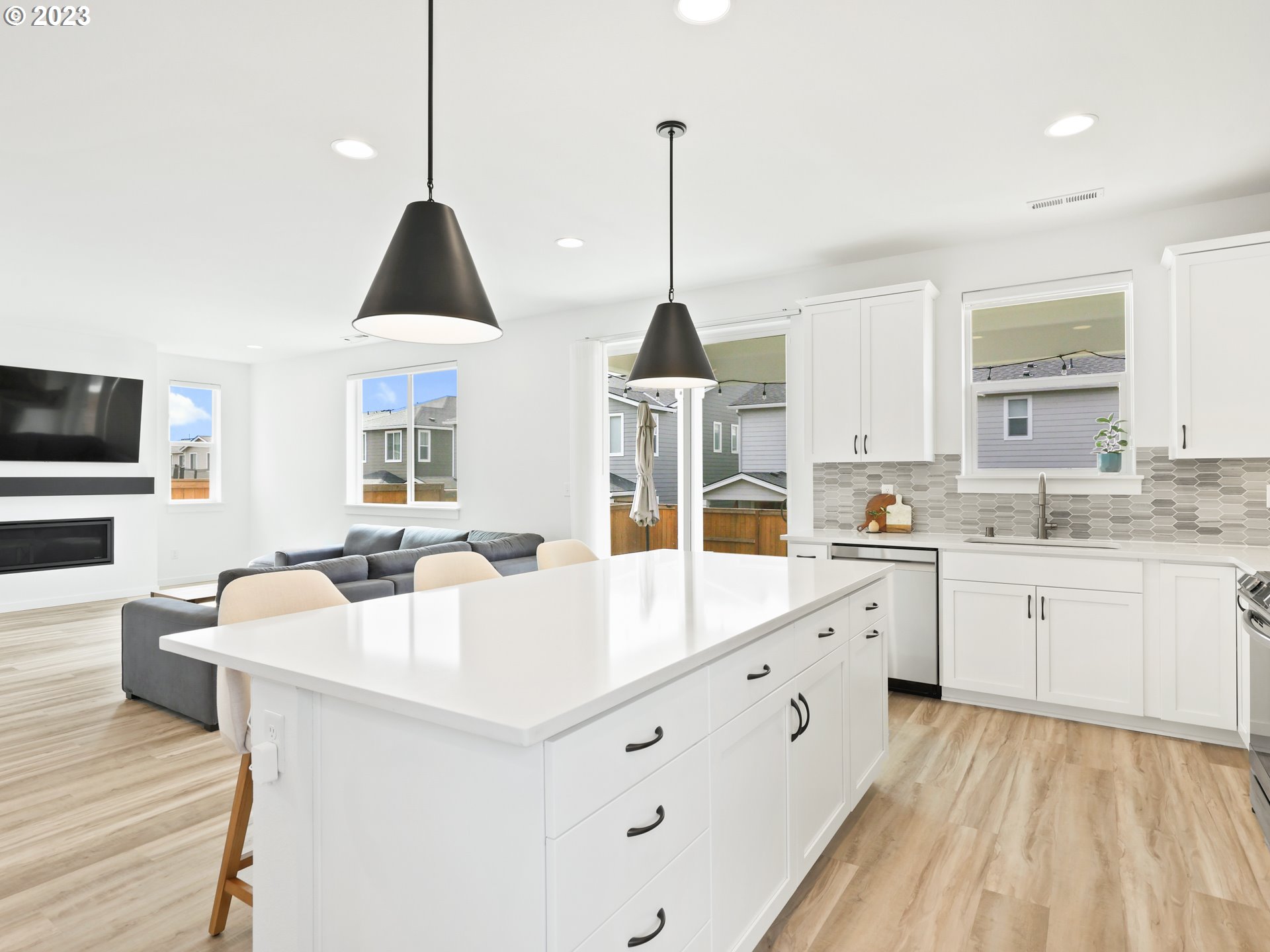 3005 North Mccanta Way Ridgefield, WA 98642 - Photo 9 of 37 a large white kitchen with cabinets