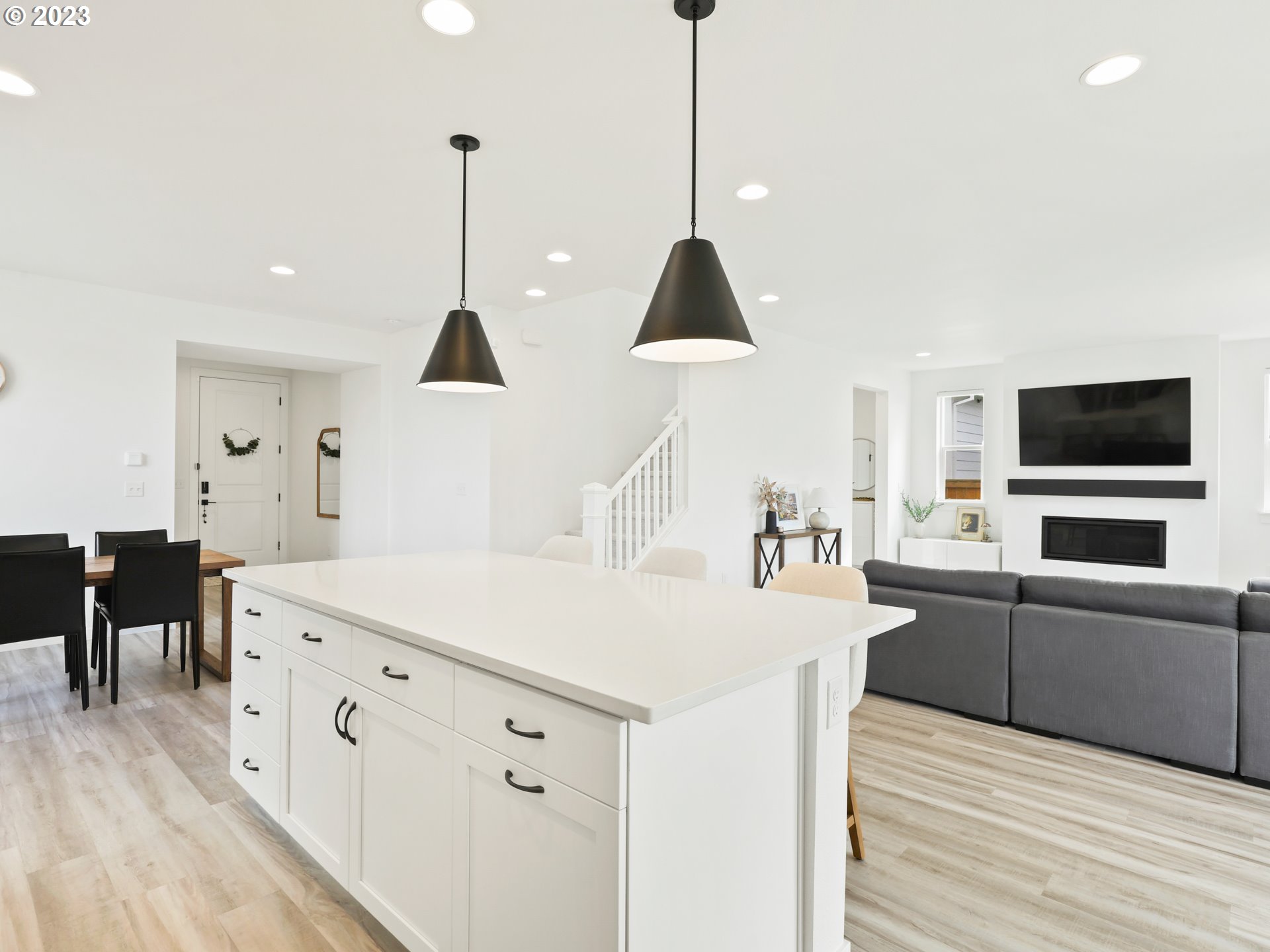 3005 North Mccanta Way Ridgefield, WA 98642 - Photo 10 of 37 a kitchen with stainless steel appliances kitchen island a white counter space and wooden floor