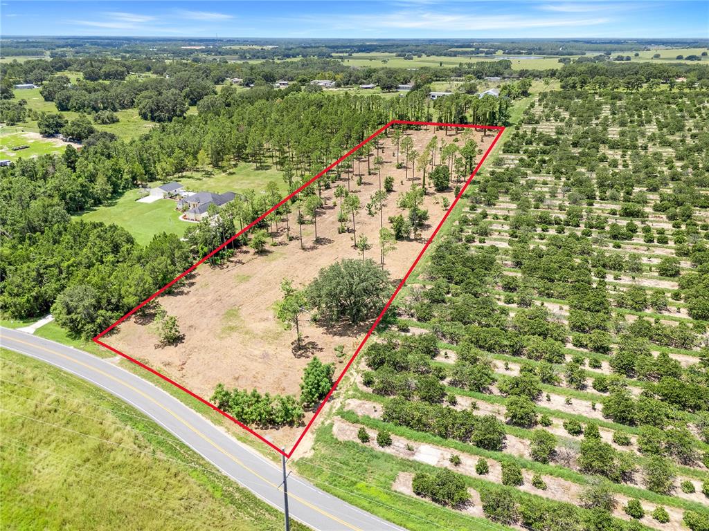 South Dewey Robbins Road Howey-in-the-Hills, FL 34737 - Photo 3 of 9 a view of a lake from a window