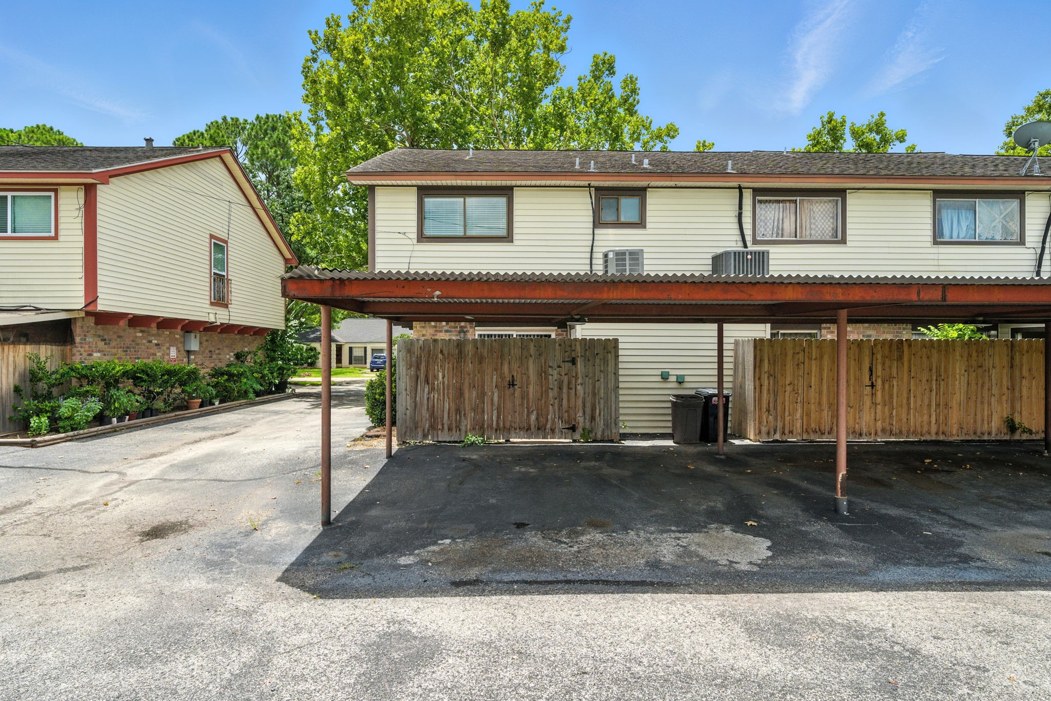 10666 Hazelhurst Drive, Unit 22 Houston, TX 77043 - Photo 18 of 19 Back Covered Parking