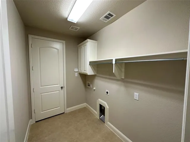 a view of a yard with a wooden fence