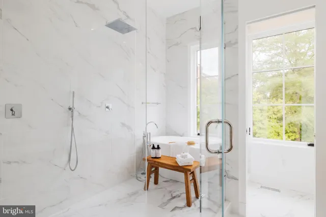 a room with table chairs and a mirror