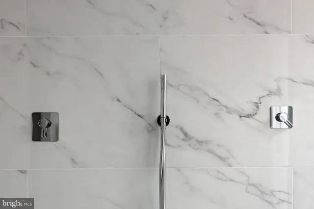 a view of entryway with bedroom and wooden floor