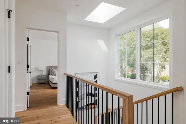 a roof deck with couches and potted plants