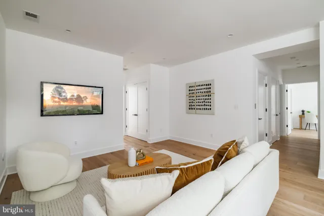 a view of a hallway with seating area
