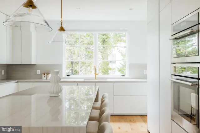 a kitchen with a window a sink and a counter top space