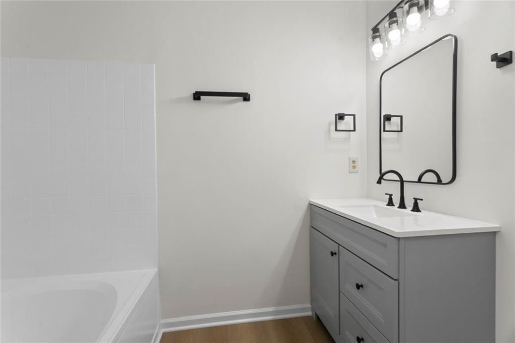 6608 Chesepeake Trail Rex, GA 30273 - Photo 13 of 32 a bathroom with a sink and a mirror