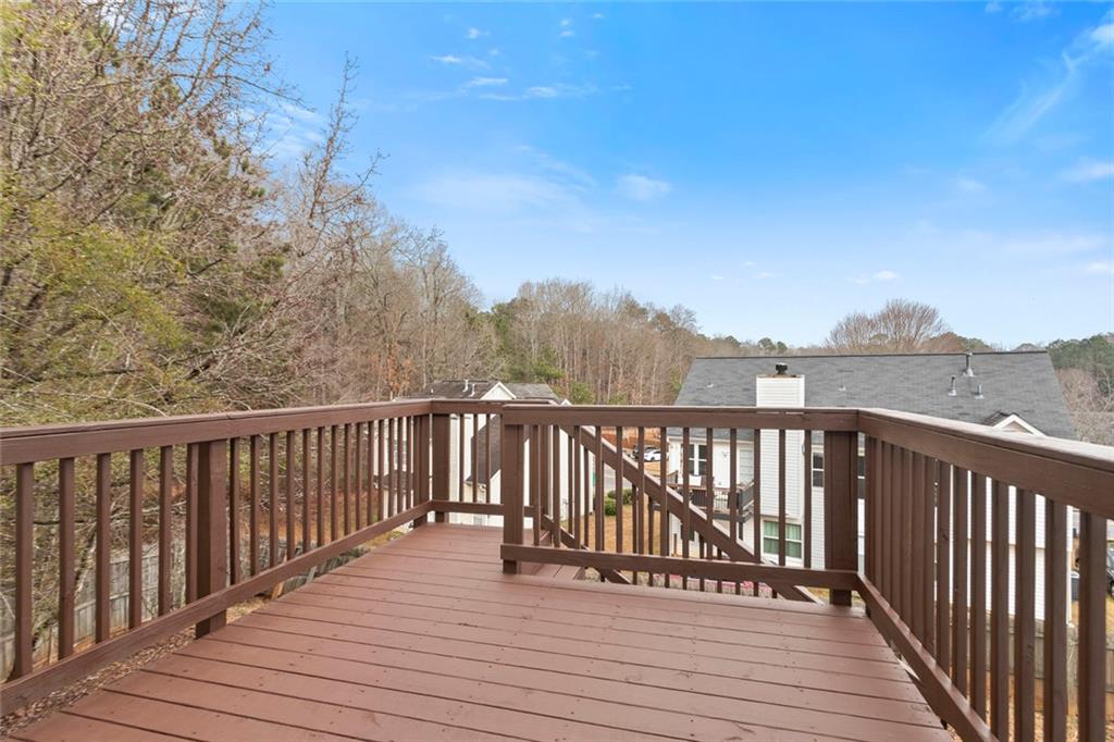 6608 Chesepeake Trail Rex, GA 30273 - Photo 25 of 32 a view of balcony with wooden floor and fence