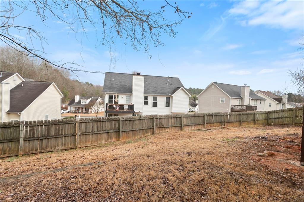 6608 Chesepeake Trail Rex, GA 30273 - Photo 28 of 32 a view of a house with a yard