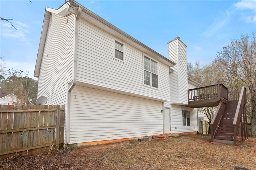 6608 Chesepeake Trail Rex, GA 30273 - Photo 29 of 32 a view of a house with a backyard