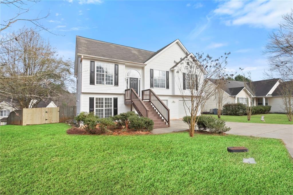 6608 Chesepeake Trail Rex, GA 30273 - Photo 3 of 32 a front view of a house with garden