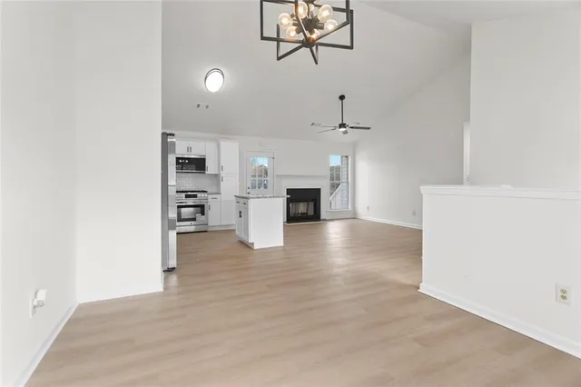 a view of kitchen and refrigerator