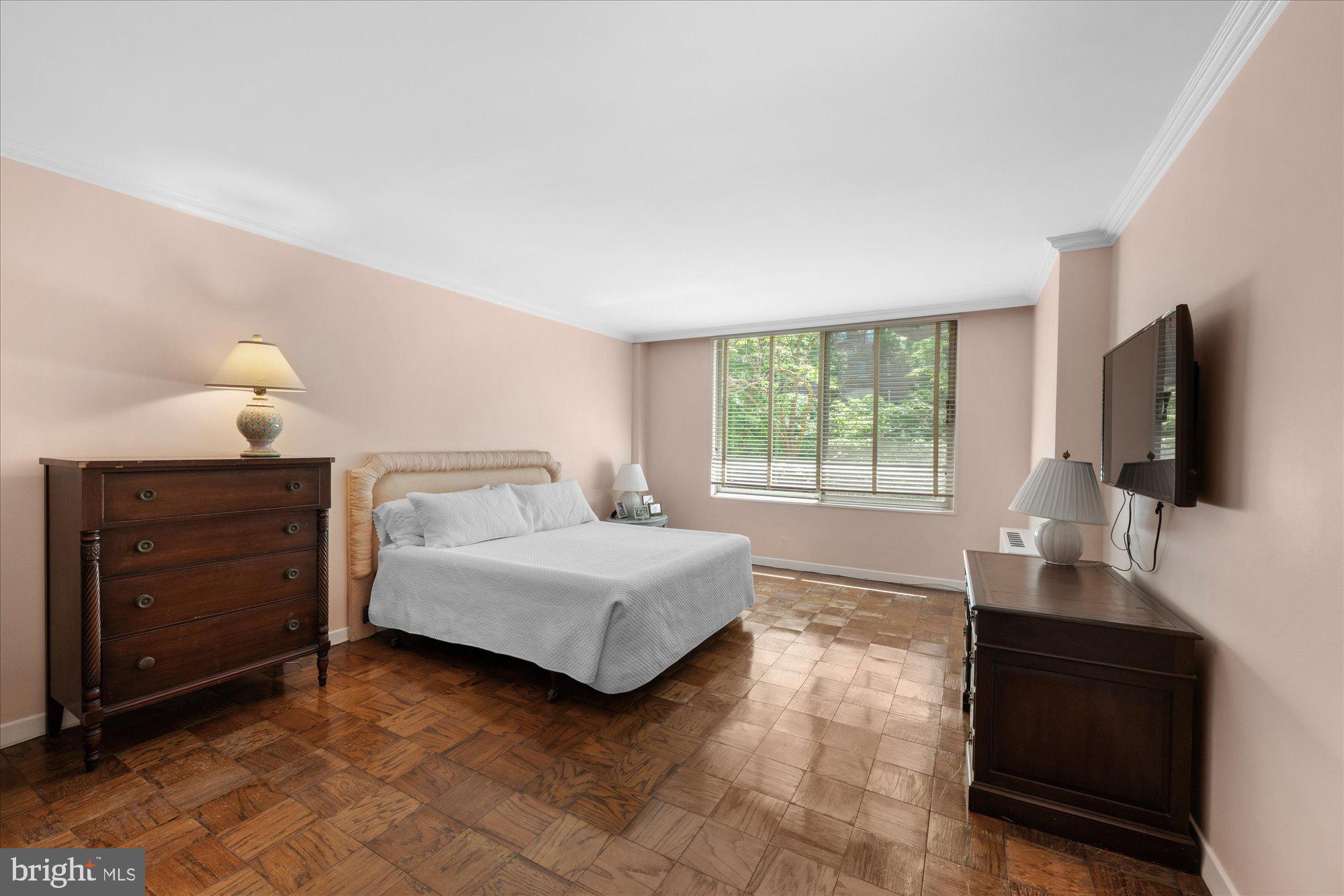 4100 Cathedral Avenue Northwest, Unit 717 Washington, DC 20016 - Photo 23 of 34 a living room with furniture and a flat screen tv