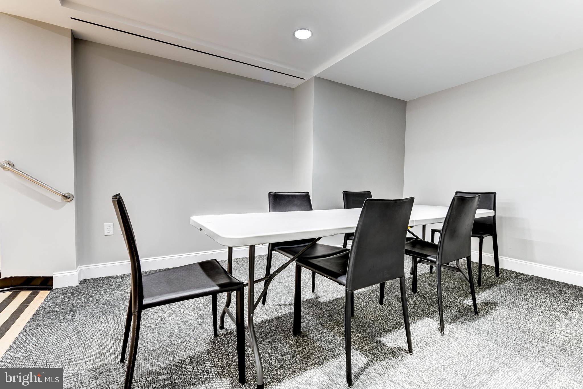 4100 Cathedral Avenue Northwest, Unit 717 Washington, DC 20016 - Photo 33 of 34 a view of a dining room with furniture