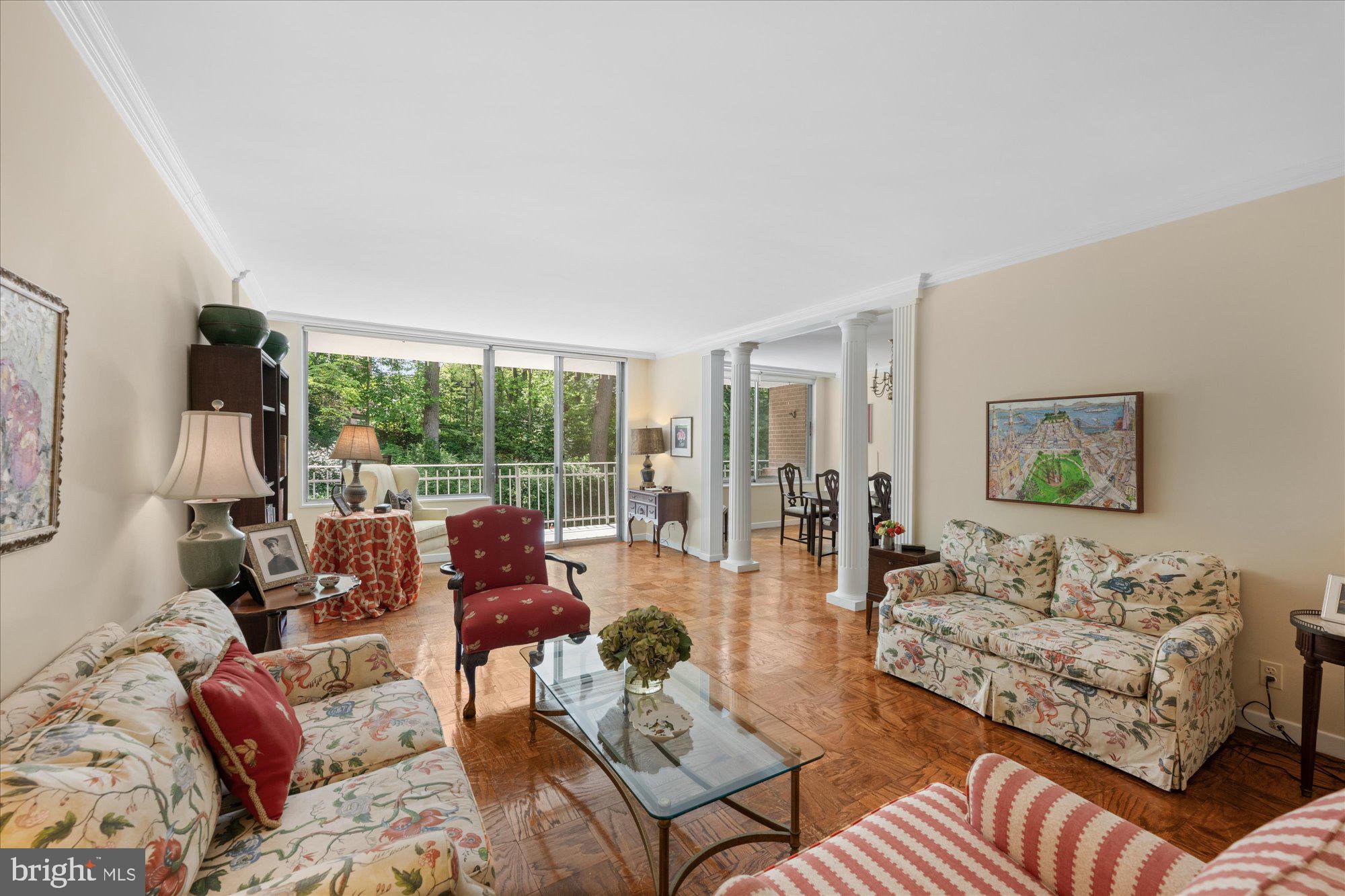 4100 Cathedral Avenue Northwest, Unit 717 Washington, DC 20016 - Photo 9 of 34 a living room with furniture and a large window