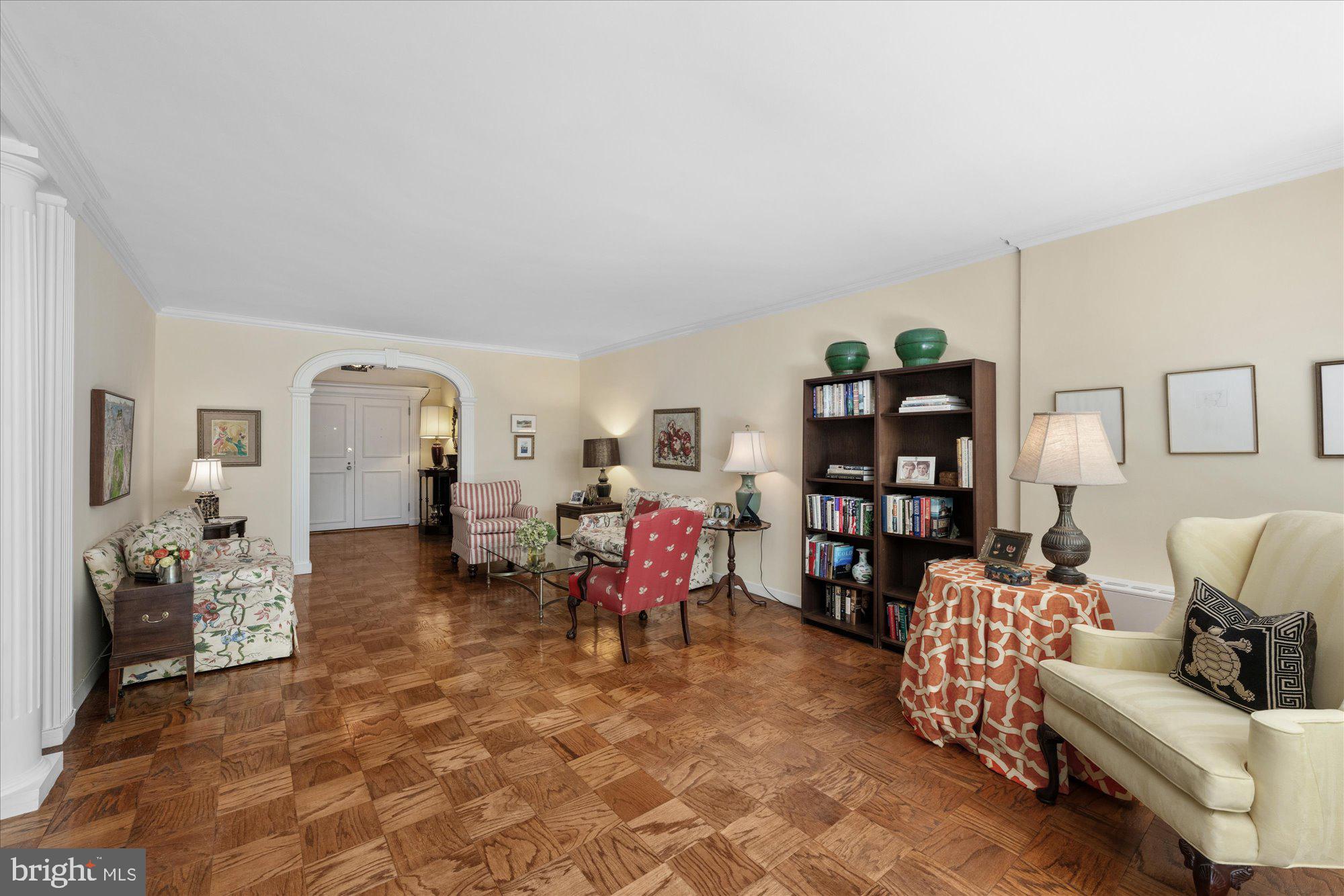 4100 Cathedral Avenue Northwest, Unit 717 Washington, DC 20016 - Photo 10 of 34 a living room with furniture and wooden floor
