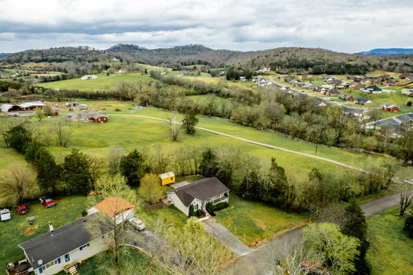 an aerial view of a houses with outdoor space