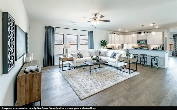a living room with furniture rug and a table