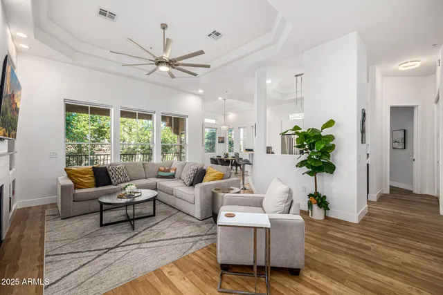 a living room with furniture and a large window