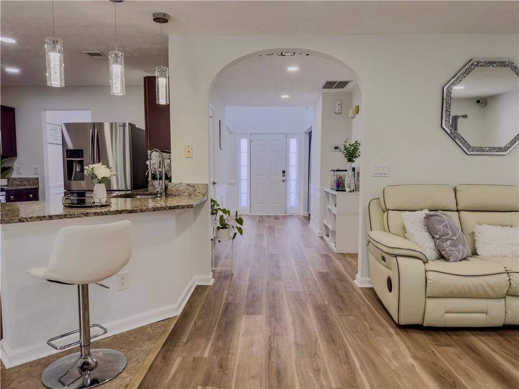 1559 Woodmore Road Southwest Marietta, GA 30008 - Photo 13 of 43 a living room with furniture and a wooden floor