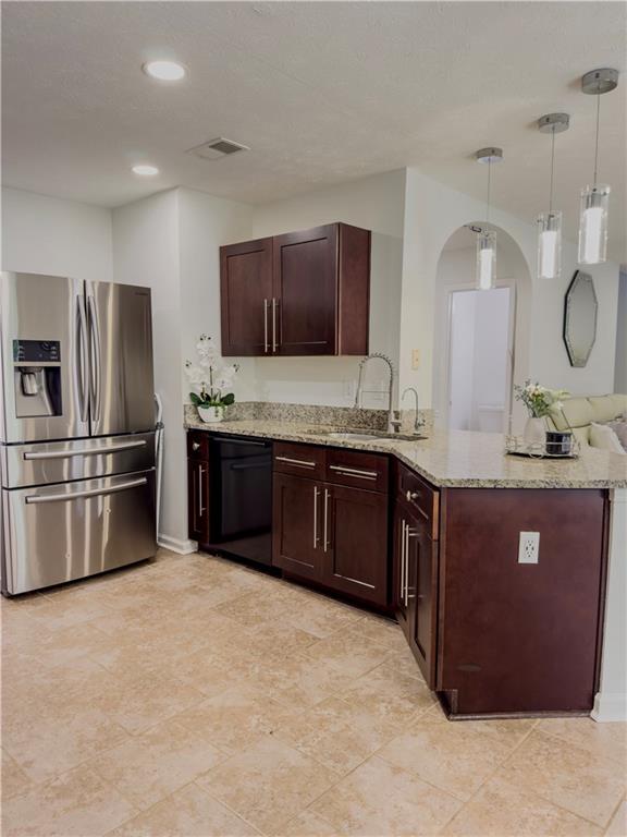 1559 Woodmore Road Southwest Marietta, GA 30008 - Photo 16 of 43 a kitchen with stainless steel appliances granite countertop a stove a sink dishwasher a refrigerator and a oven