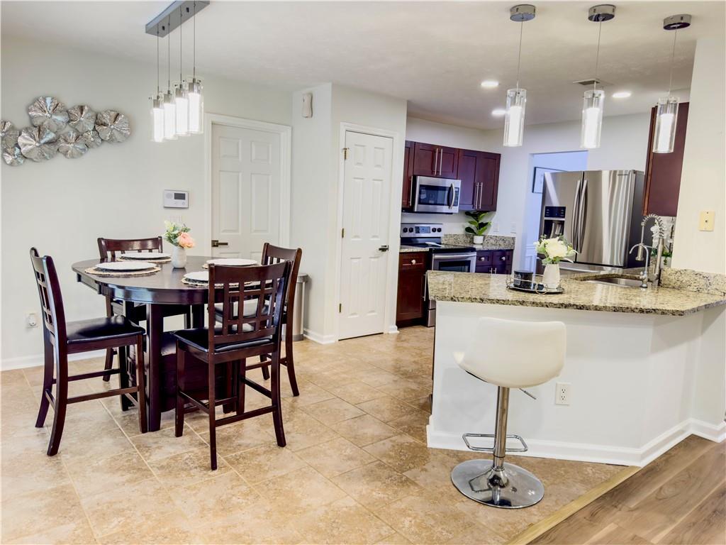 1559 Woodmore Road Southwest Marietta, GA 30008 - Photo 18 of 43 a view of a dining room with furniture