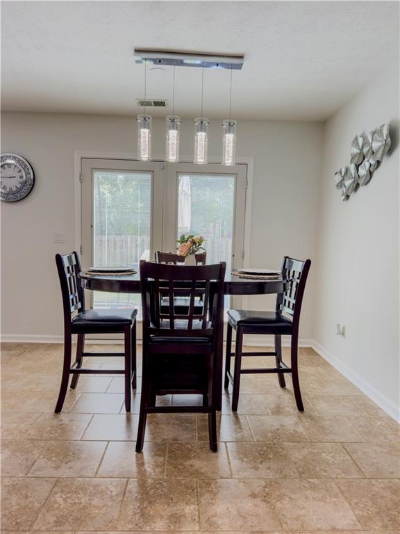 1559 Woodmore Road Southwest Marietta, GA 30008 - Photo 19 of 43 a dining room with furniture and window