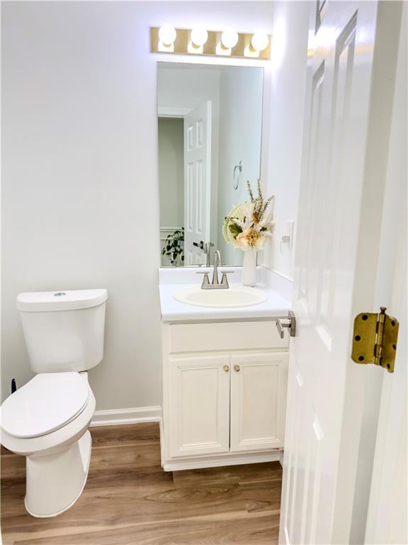 1559 Woodmore Road Southwest Marietta, GA 30008 - Photo 20 of 43 a bathroom with a sink mirror and toilet