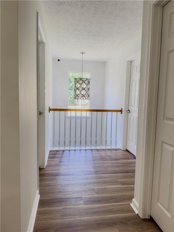 1559 Woodmore Road Southwest Marietta, GA 30008 - Photo 27 of 43 a view of a hallway with wooden floor