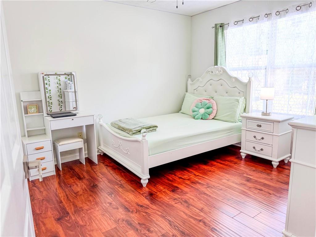 1559 Woodmore Road Southwest Marietta, GA 30008 - Photo 28 of 43 a bedroom with a bed and a window