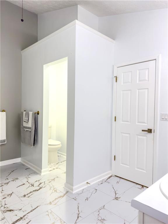 1559 Woodmore Road Southwest Marietta, GA 30008 - Photo 32 of 43 a bathroom with a sink toilet and shower