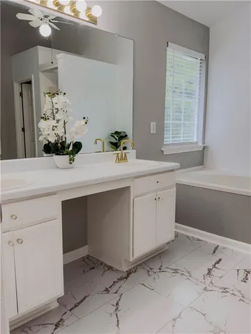 a room with a sink and a mirror