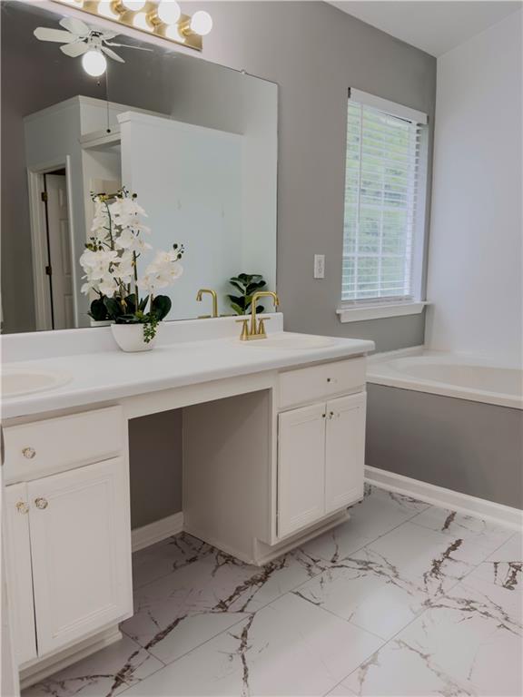 1559 Woodmore Road Southwest Marietta, GA 30008 - Photo 34 of 43 a room with a sink and a mirror