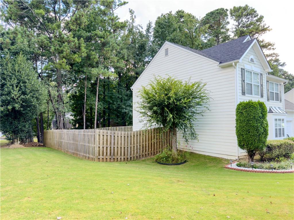 1559 Woodmore Road Southwest Marietta, GA 30008 - Photo 4 of 43 a front view of a house with garden