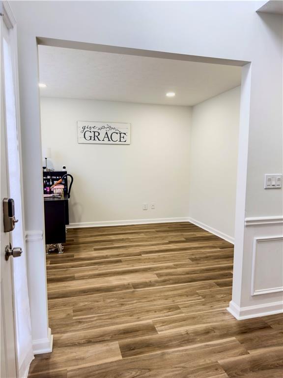 1559 Woodmore Road Southwest Marietta, GA 30008 - Photo 8 of 43 a view of empty room with wooden floor