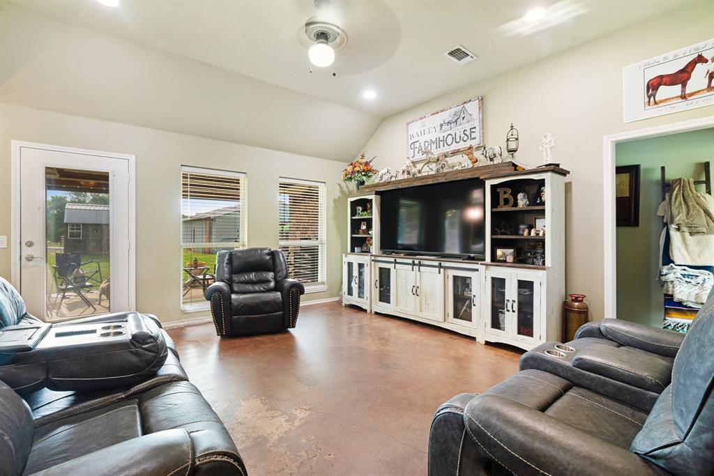 1890 County Road Sumner, TX 75486 - Photo 5 of 20 a living room with furniture and a flat screen tv