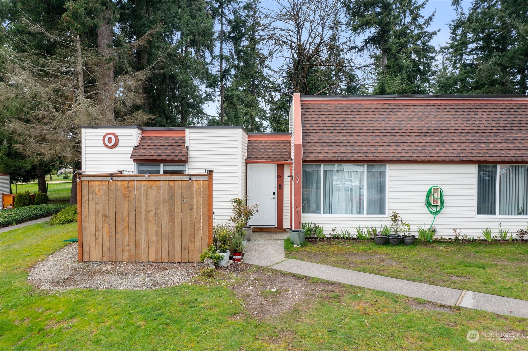 14600 Southeast 176th Street, Unit O2 Renton, WA 98058 - Photo 19 of 24 a front view of a house with garden