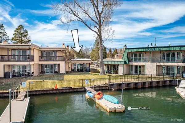 a swimming pool view with a lake view