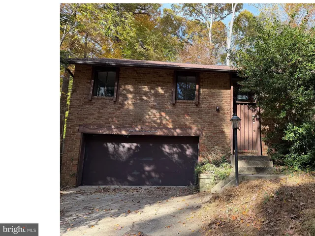 a front view of a house with yard