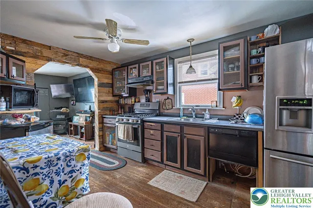 a bedroom with a bed dresser and a window