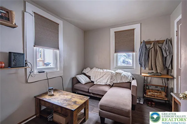 a bedroom with furniture and a window